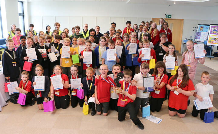 Children with certificates from the VEX robots challenge