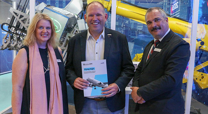 Representatives holding the aerospace policy paper