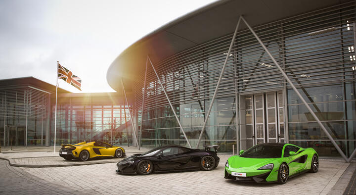 Three McLaren cars parked outside of AMRC Factory 2050