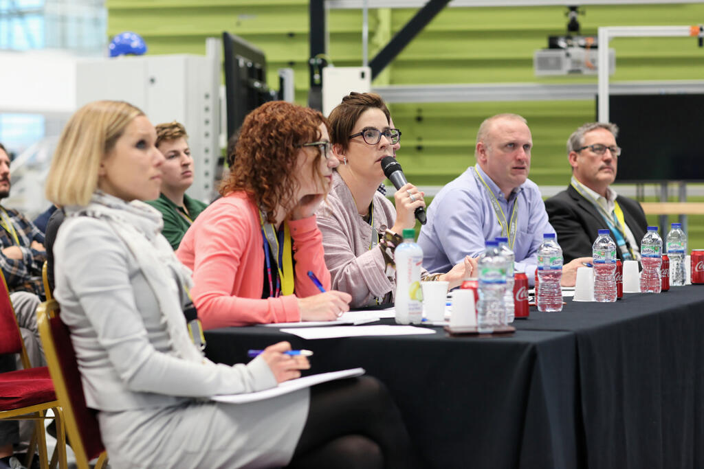 The Rolls-Royce judges questioning the hack teams.