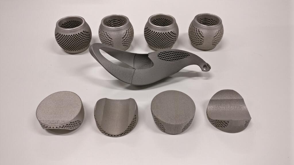 Good vibrations: The tonearm mount (centre) for a state-of-the-art record player, fluted cups (bottom) to go between the shelves and carbon fibre bars on a Hi-Fi rack, and load-bearing steel spheres (top) that sit on the four corners of each section of the rack to isolate the shelves.