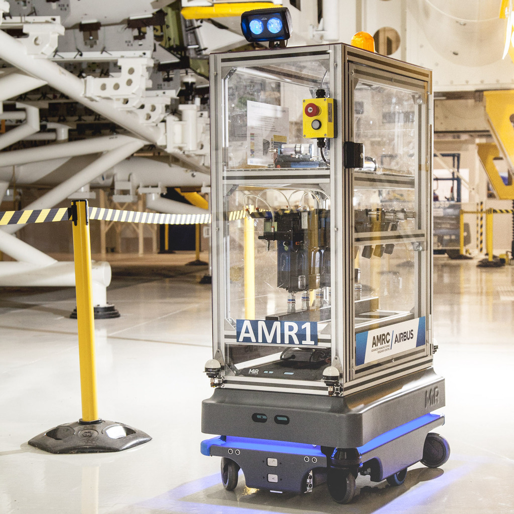 The MiR200 robot with racking, integrated flashing beacon and direction indicator projector.