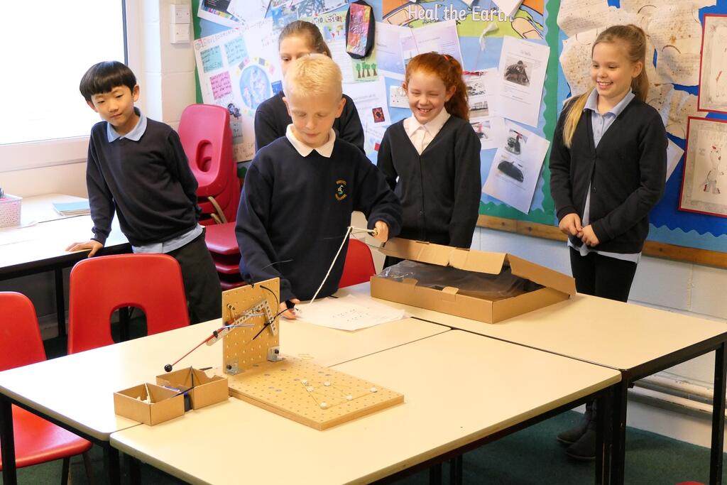 Members of Brockwell Junior School's STEM Club demonstrate their designs at work.