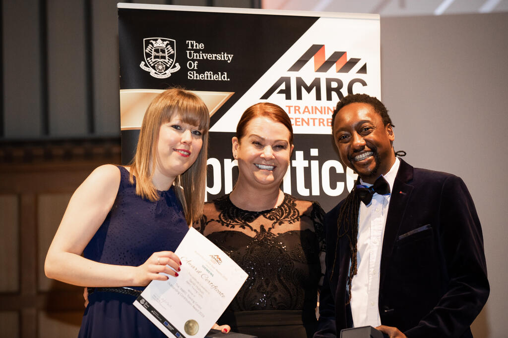 Top team: Lecturer Itai Vutabwarova and support staff Sarah Hudson collect their awards from training centre director Nikki Jones, centre. 