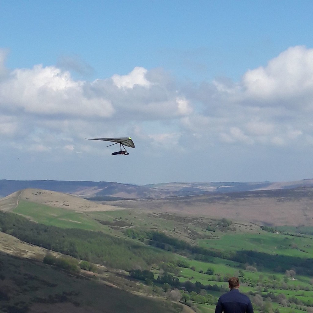Director at Avian Hang Gliders, Dr Tim Swait, tests a hang glider in the Peak District.