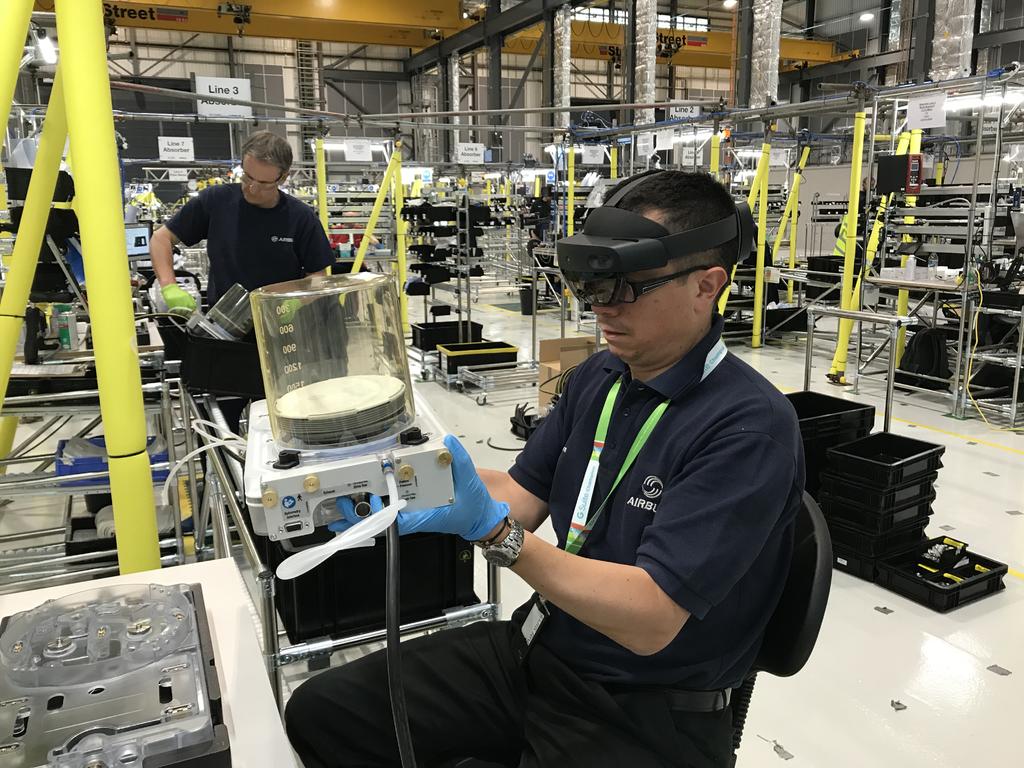 An Augmented Reality (AR) headset is used by a production line operative at AMRC Cymru to assemble life-saving ventilators.