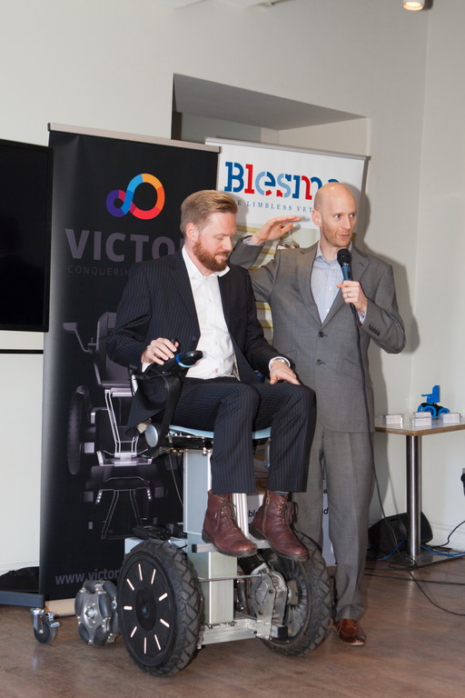 Samuel Rees (seated) and Marcus Crossley, from the Medical AMRC, outline the principles of the new mobility device, using a prototype device.